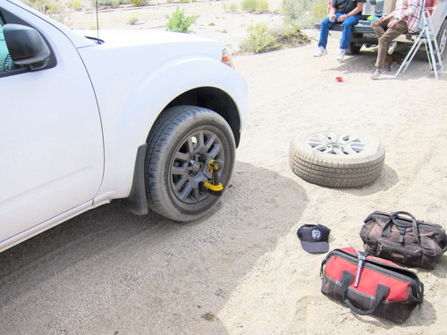 No more than 15 minutes later after towing Mike off the Ledge I get a flat front passenger tire thanks to a healthy piece of metal. 